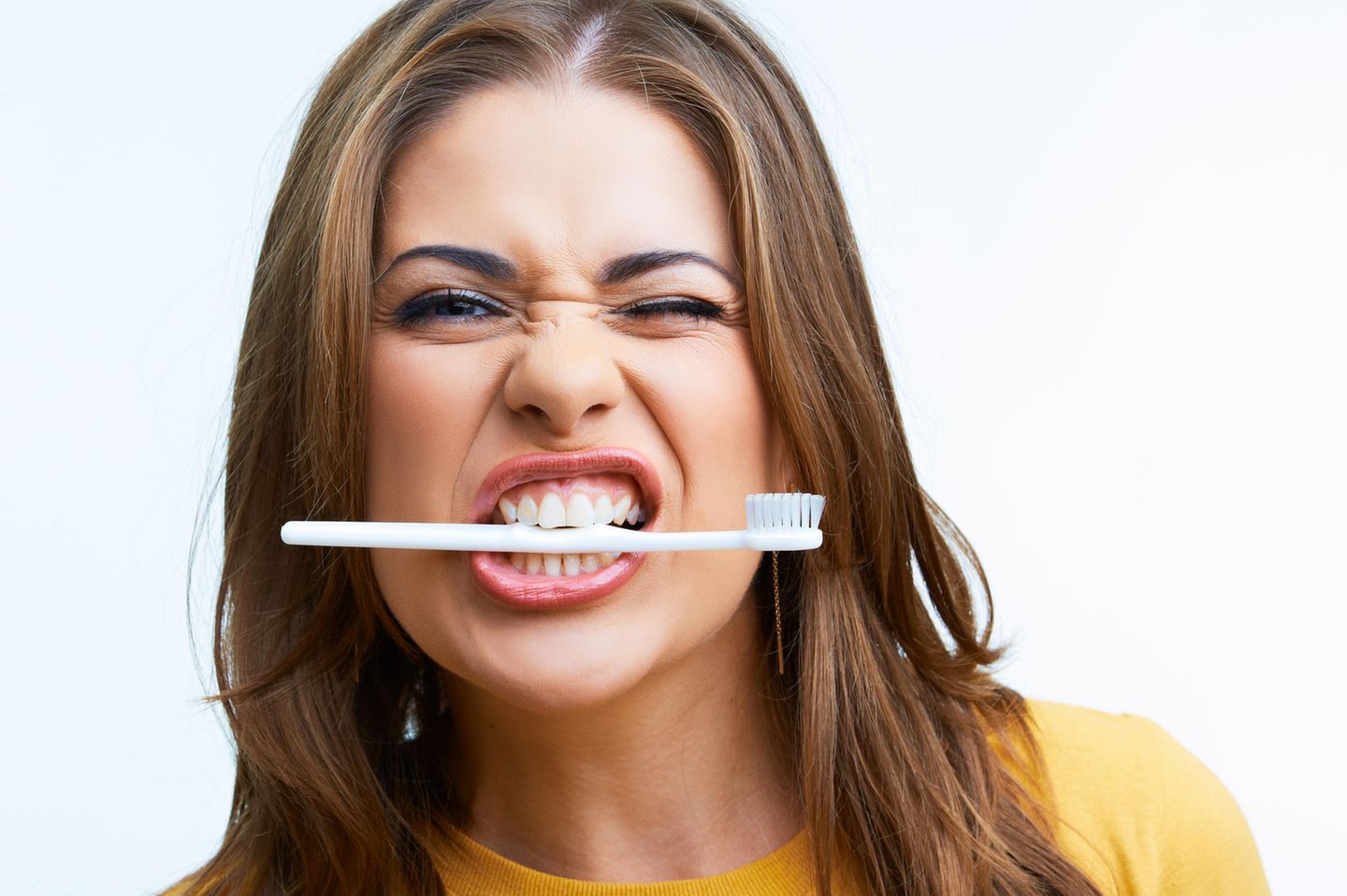 Woman with toothbrush in mouth