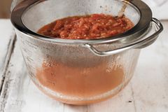 Pour tomato soup through a sieve