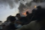 1. Preis in der Kategorie: Spot News, Singles  Der amerikanische Fotograf John Moore war vor Ort, als am 27. Dezember ein Anschlag auf die pakistanische Oppositionspolitikerin Benazir Bhutto verübt wurde - mit seiner Kamera hielt er den Moment des Attentats fest. Bhutto starb an den Folgen der Explosion