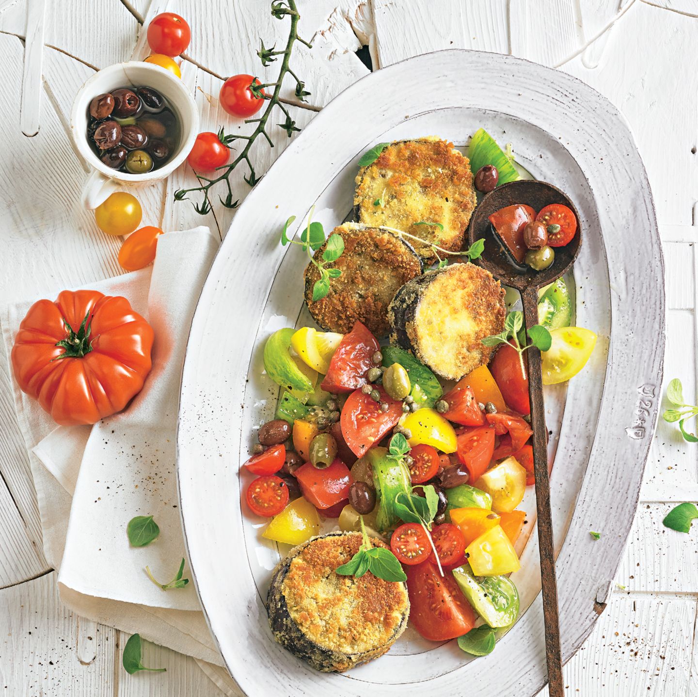 Eggplant schnitzel with tomato and olive salad