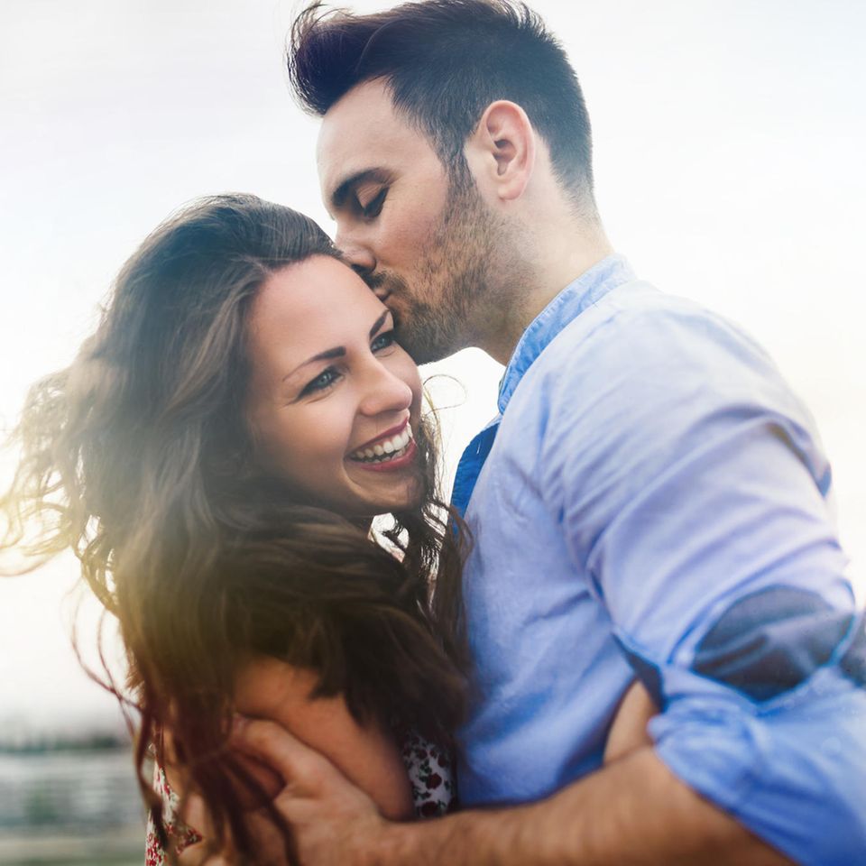 Couple styles: a man kisses a woman on the cheek