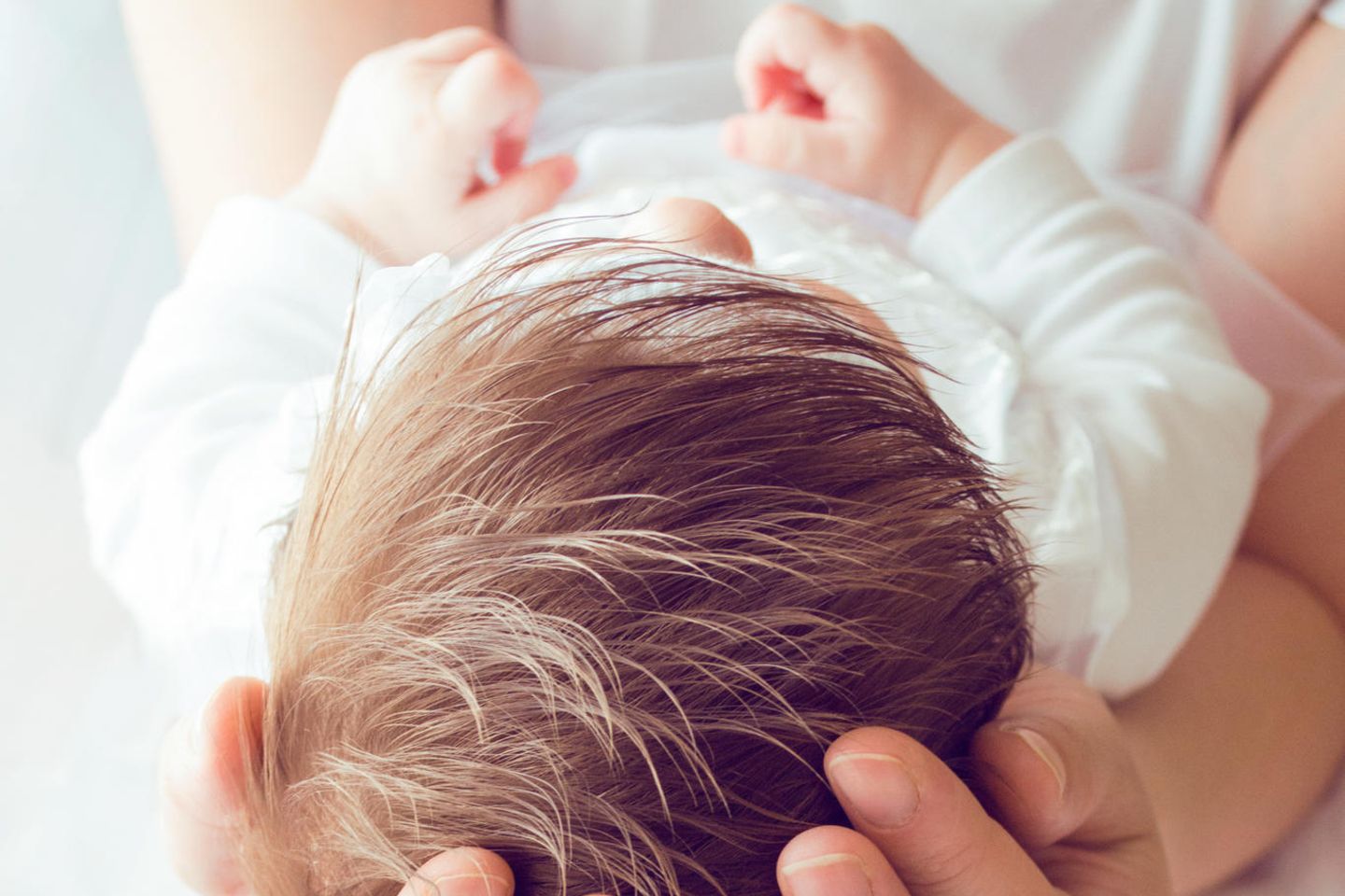 Sprüche zur Taufe: Baby bei der Taufe