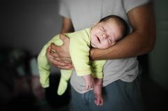 Breastfeeding ritual: Baby sleeps in dad's arm