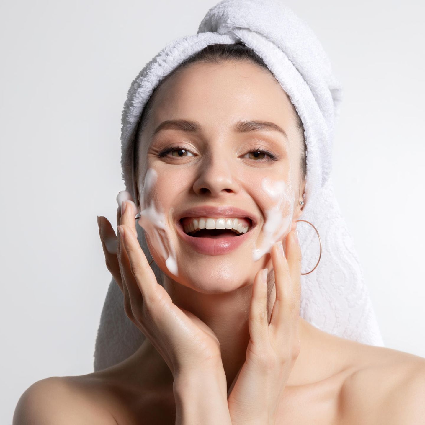 Moisturizer: woman creams face, facial care
