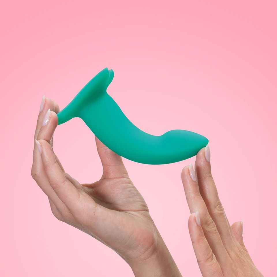 Limba Flex against a pink background in woman's hands