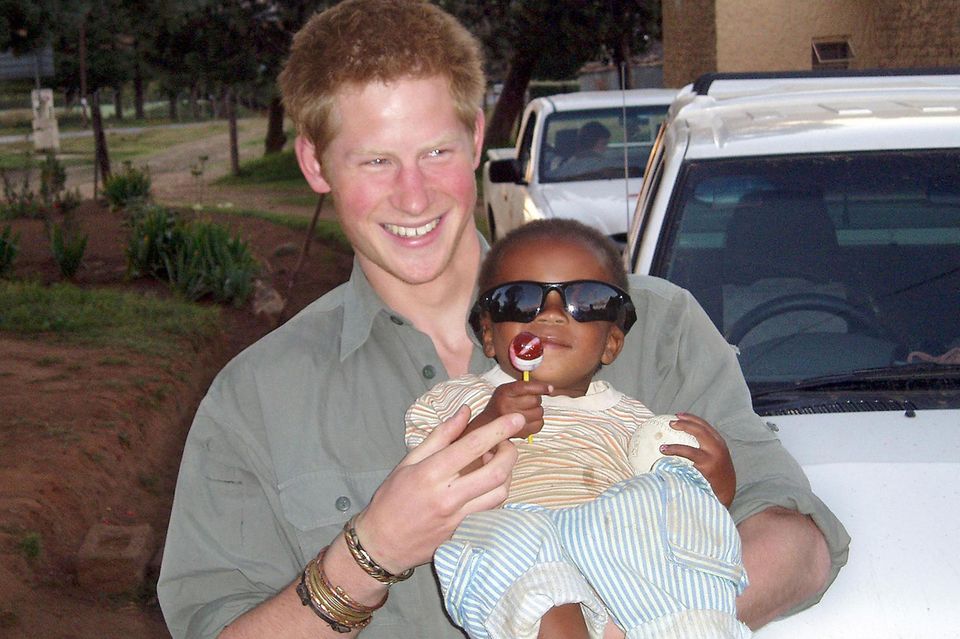 Prince Harry is shown wearing the same silver bracelet during a trip to Lesotho, Africa. 