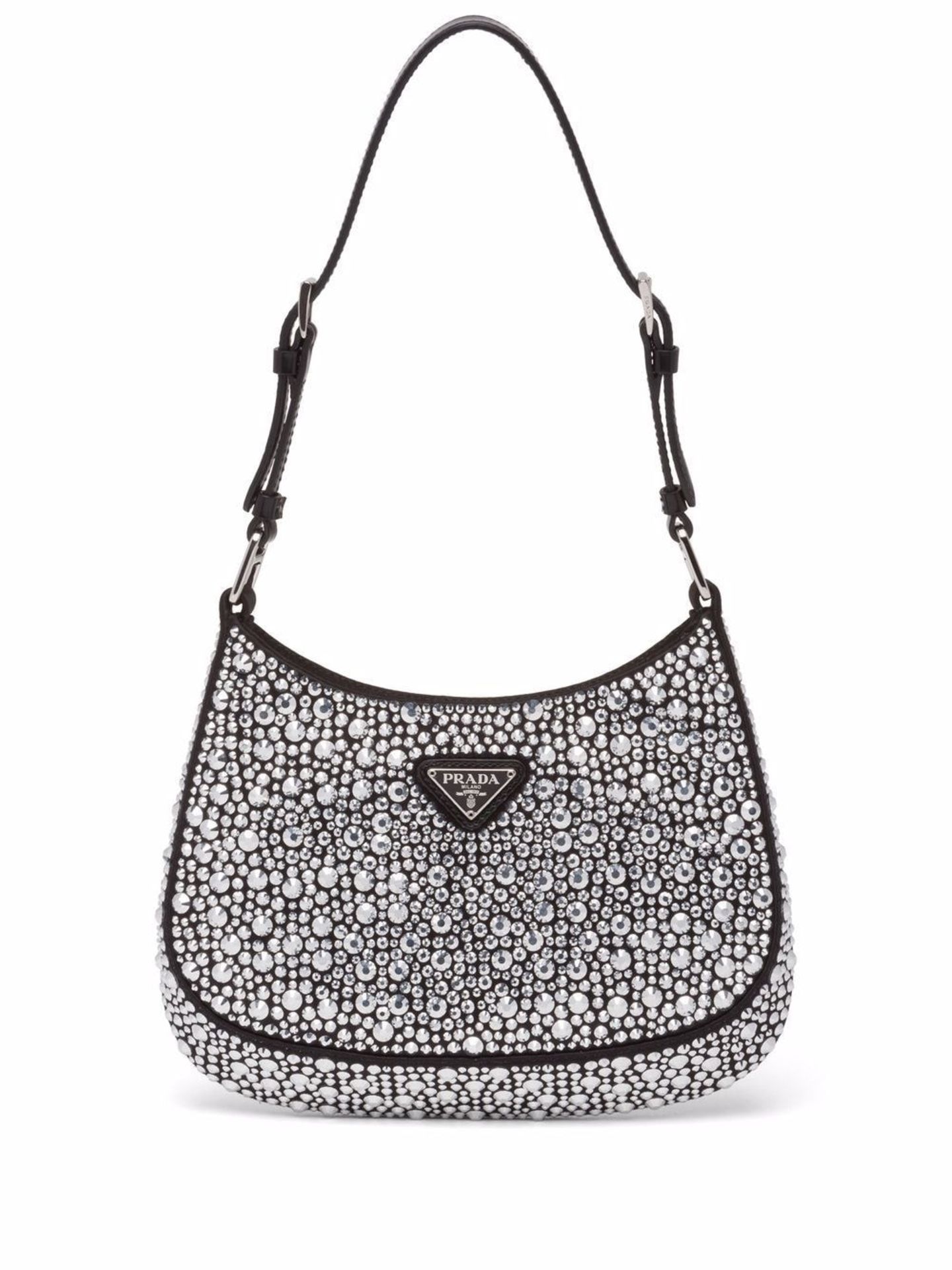 Die Schultertasche "Cleo" mit Kristallverzierungen von Prada begegnet uns aktuell überall auf Instagram. Die kleine It-Bag sieht nicht nur besonders aus, sie macht auch jeden Look gleich ein bisschen eleganter. Von Prada, etwa 2600 Euro.