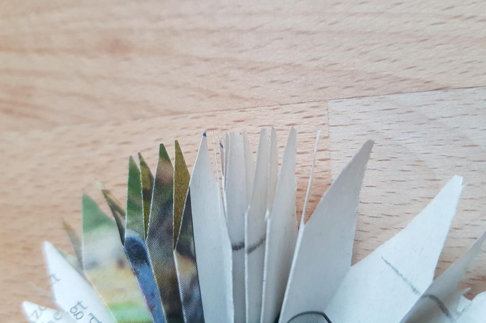 Geldscheine zur Sonne falten: Origami-Sonne