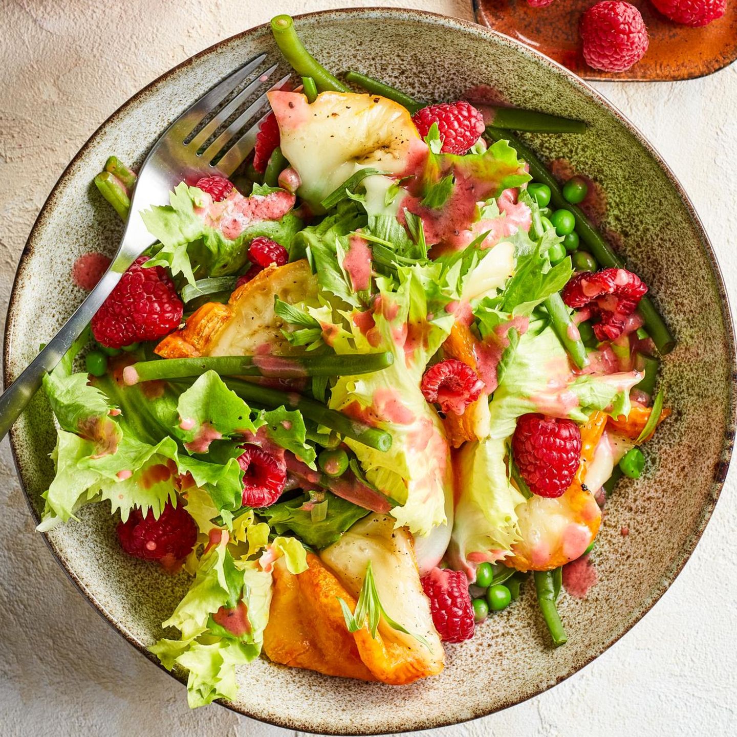 Endive salad with gratinated cheese and raspberries