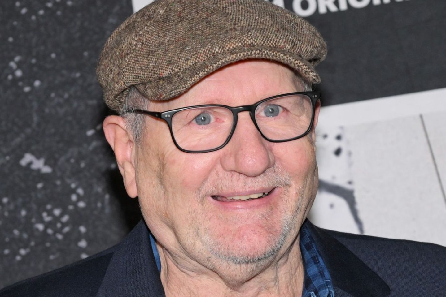 Ed O'Neill is bald for the room.