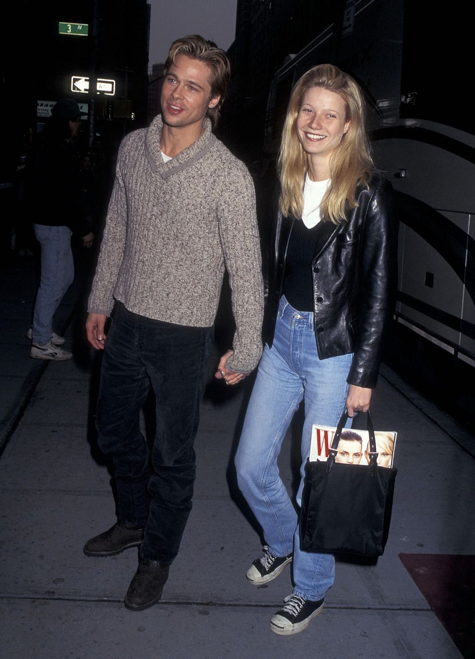 In 1996, Gwyneth Paltrow opted for a classic look of the time: jeans and a leather jacket. The actress beamed at the camera alongside her then-boyfriend Brad Pitt.